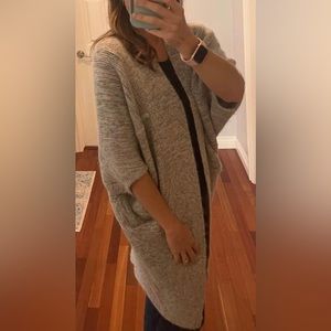 Aritzia wool /cashmere blend. VERY oversized fit. I am 5’5, 122 pds for referenc
